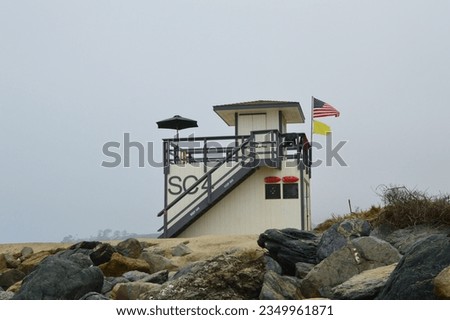 An empty lifeguard stand in the early morning awaits the buzz of beach goers in Dana Point, CA.