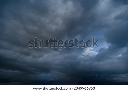 storm sky, dark dramatic clouds during thunderstorm, rain and wind, extreme weather, abstract background Royalty-Free Stock Photo #2349966953