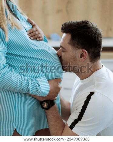 Husband supporting pregnant woman. Hopeful pregnant lady with husband.