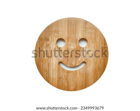 The circle wooden plate with smiley face on white background.