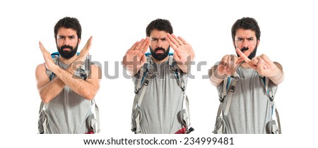 Set of Backpacker making stop sign over white background