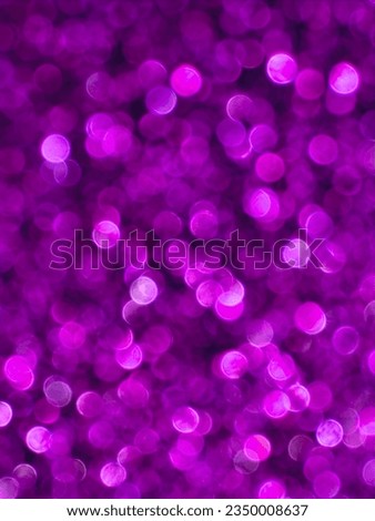 Glittery abstract purple bokeh background effect