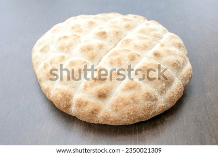 Grill Pita Bread: The traditional Lepinja grilled bread is delivered fresh from the oven. Wheat bread is often combined with minced patties, grilled food, or cevapcici. Royalty-Free Stock Photo #2350021309