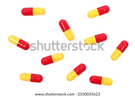 Red yellow capsules isolated on white, clipping