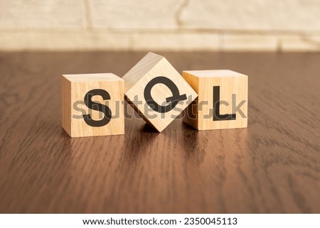 concept with symbols SQL on wooden blocks