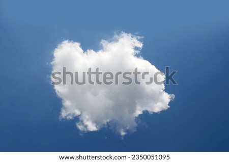 Single cloud isolated over blue sky background. White cloud photo, cute fluffy puffy cloud and gradient summer sky Royalty-Free Stock Photo #2350051095