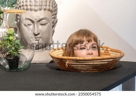 Head on a plate generic optical illusion, size, girl peeking out face closeup, detail, one person. World perception, science, kids curiosity abstract concept, head in a bowl on a table up close, peek