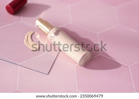 Skin care product ad. Minimal beauty product styling and photography. Foundation texture. Foundation photography styling on pink tile.  Minimalist photography. Advertising Photography.