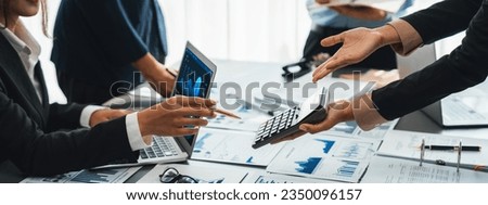 Auditor and accountant team working in office, analyze financial data and accounting record with calculator. Accounting company provide finance and taxation planning for profitable cash flow. Insight Royalty-Free Stock Photo #2350096157
