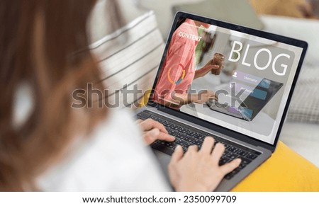 Woman ues laptop computer with social media online content, freelance worker, working online, content creator, blogger, technology, website, woman reading blog online on computer at home