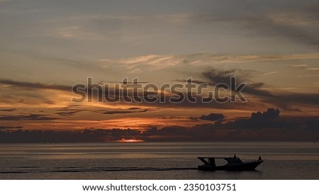 Crossing the sea at sunset using a ship