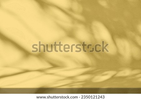 Gold Stucco Table with Nature Shadow on Concrete Wall Texture Background, Suitable for Cosmetic Product Presentation Backdrop, Display, and Mock up.