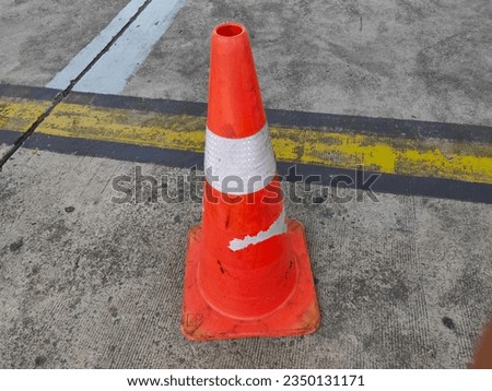 Orange Safety Cone on the Ground