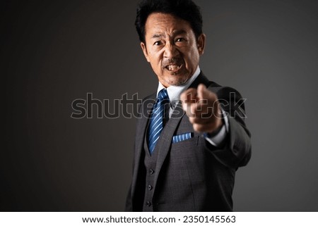 Business image of a surprised middle man Royalty-Free Stock Photo #2350145563