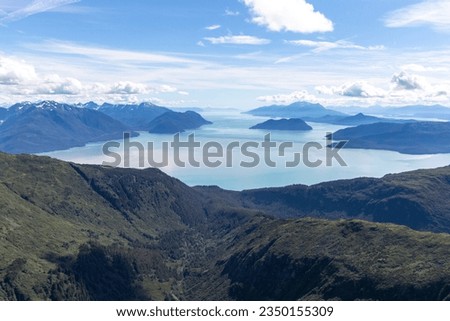 Aerial photo of a mountain peak near Juneau, Alaska with Gastineau Channel and Stephens passage in the background. Royalty-Free Stock Photo #2350155309
