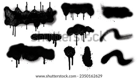Set of black color spray paint or graffiti design element on the white wall background. Royalty-Free Stock Photo #2350162629