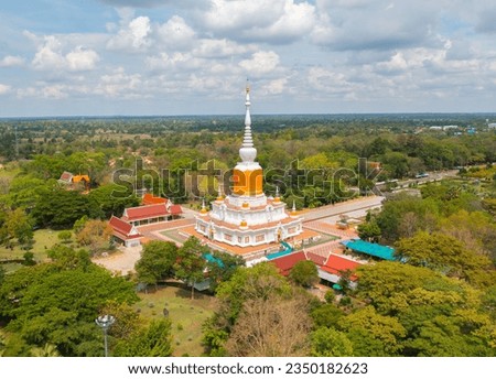 Phra That Na Dun temple pagoda is a buddhist temple in Maha Sarakham, an urban city town, Thailand. Thai architecture landscape background. Tourist attraction landmark.