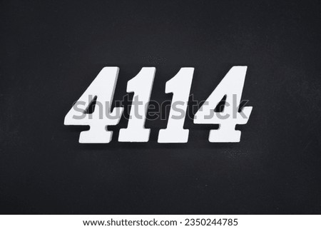 Black for the background. The number 4114 is made of white painted wood.