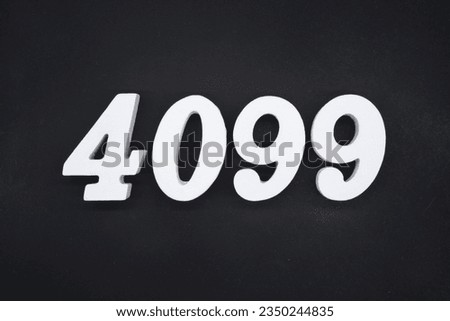 Black for the background. The number 4099 is made of white painted wood.