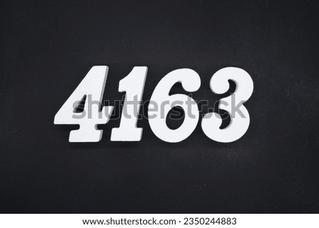 Black for the background. The number 4163 is made of white painted wood.