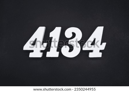 Black for the background. The number 4134 is made of white painted wood.