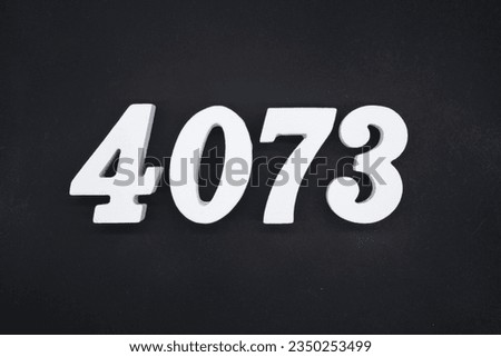 Black for the background. The number 4073 is made of white painted wood.