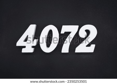Black for the background. The number 4072 is made of white painted wood.