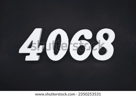 Black for the background. The number 4068 is made of white painted wood.