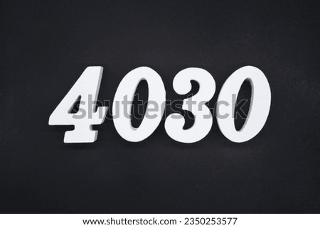 Black for the background. The number 4030 is made of white painted wood.