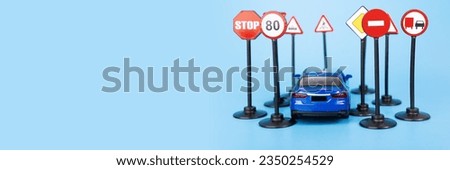 car and road signs banner, car and road signs on a blue background, copy space, traffic safety