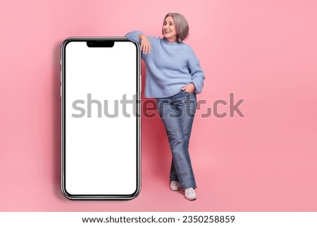 Full body length size photo of grey bob hair mature age lady stay relaxed big smartphone display amazon sale isolated on pink color background