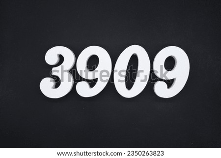 Black for the background. The number 3909 is made of white painted wood.