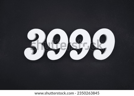 Black for the background. The number 3999 is made of white painted wood.