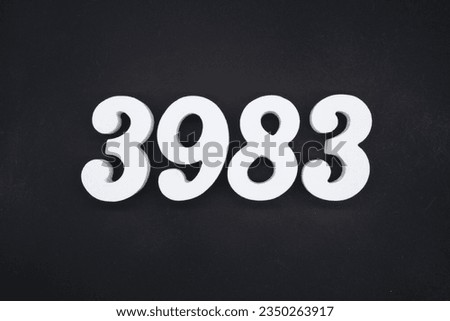 Black for the background. The number 3983 is made of white painted wood.