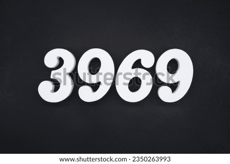 Black for the background. The number 3969 is made of white painted wood.