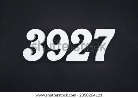 Black for the background. The number 3927 is made of white painted wood.