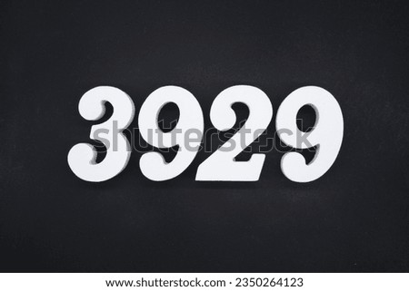 Black for the background. The number 3929 is made of white painted wood.