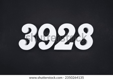 Black for the background. The number 3928 is made of white painted wood.