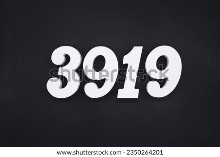Black for the background. The number 3919 is made of white painted wood.