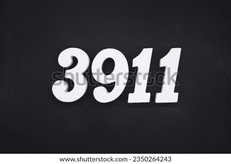 Black for the background. The number 3911 is made of white painted wood.