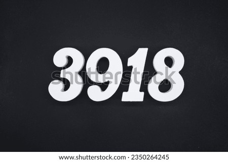 Black for the background. The number 3918 is made of white painted wood.