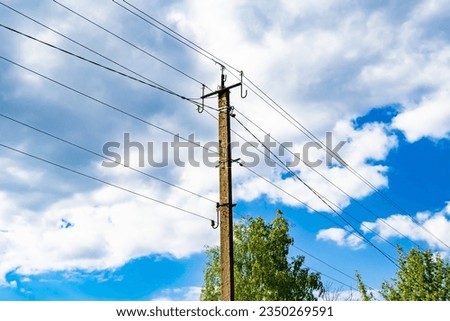 Power electric pole with line wire on colored background close up, photography consisting of power electric pole with line wire under sky, line wire in power electric pole for residential buildings Royalty-Free Stock Photo #2350269591