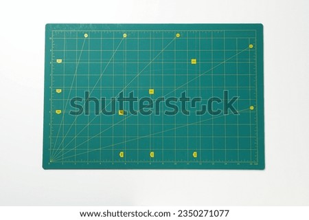Patchwork accessories concept on white background, cutting mat
