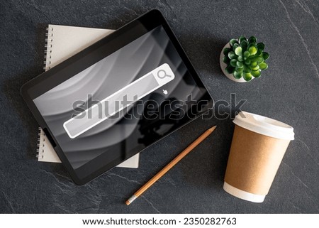 Digital tablet with internet browser search bar on screen.