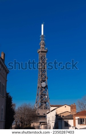 Lyon, France - January 25, 2022: The Metallic tower of Fourviere, a landmark of Lyon, France, is a steel framework tower on the Fourviere hill. Royalty-Free Stock Photo #2350287403