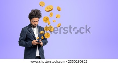 Arab businessman typing in phone, falling gold dollar coins on empty copy space purple background. Concept of transaction, money transfer, income and payments Royalty-Free Stock Photo #2350290821