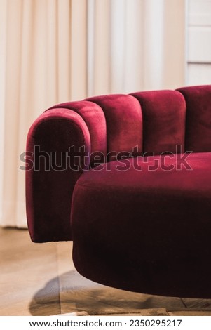 Burgundy red ribbed sofa detail Royalty-Free Stock Photo #2350295217