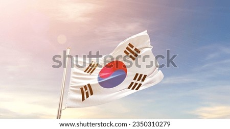 Korea South  national flag waving in beautiful sky. Royalty-Free Stock Photo #2350310279