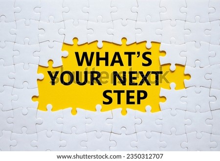 What is your next step symbol. White puzzle with words What is your next step. Beautiful yellow background. Business concept. Copy space.