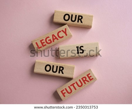 Our Legacy is our Future symbol. Concept words Our Legacy is our Future on wooden blocks. Beautiful pink background. Business concept. Copy space